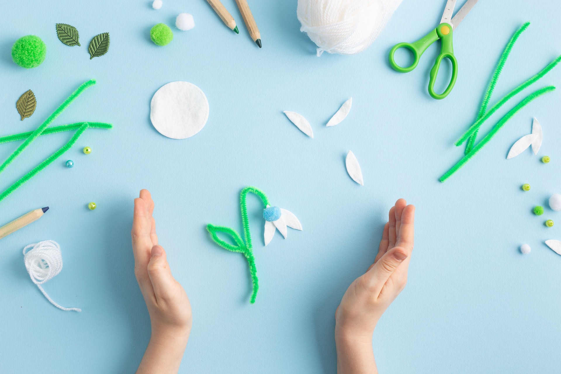 Step by step diy process of making snowdrops flowers. Creativity, crafting with kids.